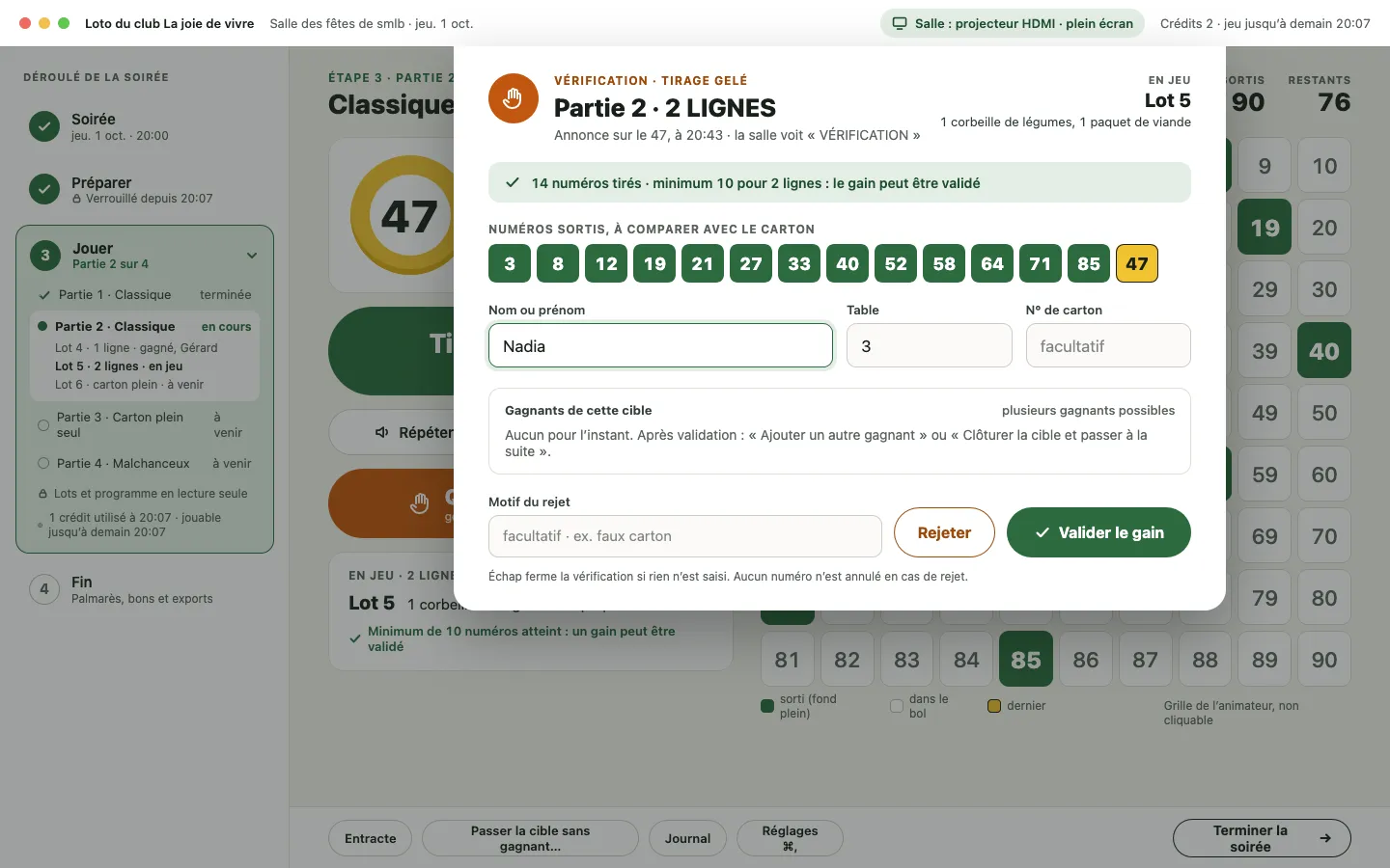 Fenêtre de vérification : « Tirage gelé », 14 numéros tirés pour un minimum de 10, la liste des numéros sortis à comparer avec le carton, puis « Rejeter » ou « Valider le gain ».